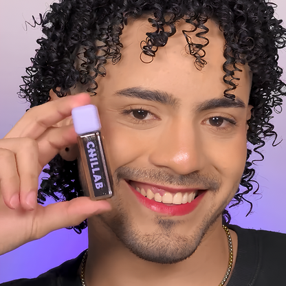 man wear red lips smiling with chillab lip oil